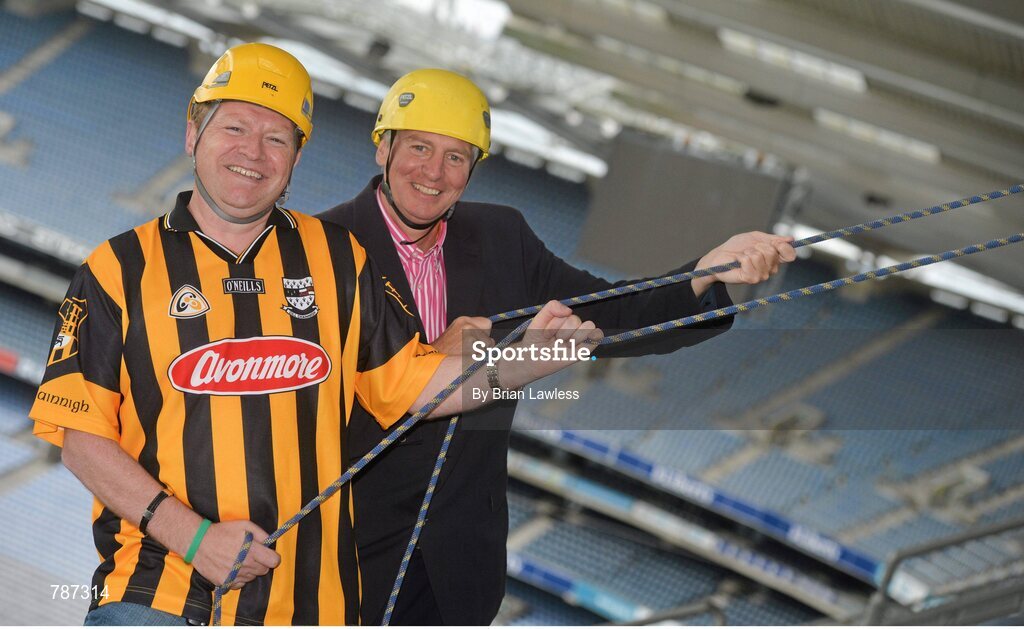 28 August 2013; The Sunday Game Presenter Michael Lyster was joined today in Croke Park by motor neurone disease (MND) sufferer Paul Lannon and friends sporting their county colours to encourage others from across Ireland to abseil 100ft off the Hogan Stand in aid of the Irish Motor Neurone Disease Association (IMNDA). At the event is Michael Lyster with Paul Lannon, from Knocktopher, Co. Kilkenny, left. Croke Park, Dublin. Picture credit: Brian Lawless / SPORTSFILE