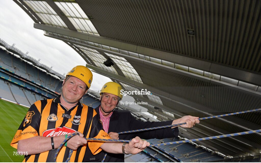 28 August 2013; The Sunday Game Presenter Michael Lyster was joined today in Croke Park by motor neurone disease (MND) sufferer Paul Lannon and friends sporting their county colours to encourage others from across Ireland to abseil 100ft off the Hogan Stand in aid of the Irish Motor Neurone Disease Association (IMNDA). At the event is Michael Lyster with Paul Lannon, from Knocktopher, Co. Kilkenny, left. Croke Park, Dublin. Picture credit: Brian Lawless / SPORTSFILE