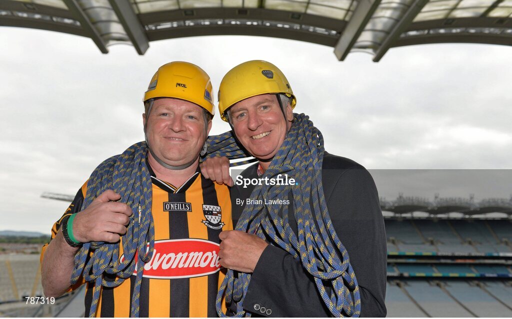 28 August 2013; The Sunday Game Presenter Michael Lyster was joined today in Croke Park by motor neurone disease (MND) sufferer Paul Lannon and friends sporting their county colours to encourage others from across Ireland to abseil 100ft off the Hogan Stand in aid of the Irish Motor Neurone Disease Association (IMNDA). At the event is Michael Lyster with Paul Lannon, from Knocktopher, Co. Kilkenny, left. Croke Park, Dublin. Picture credit: Brian Lawless / SPORTSFILE