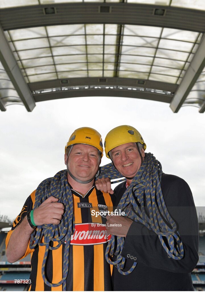 28 August 2013; The Sunday Game Presenter Michael Lyster was joined today in Croke Park by motor neurone disease (MND) sufferer Paul Lannon and friends sporting their county colours to encourage others from across Ireland to abseil 100ft off the Hogan Stand in aid of the Irish Motor Neurone Disease Association (IMNDA). At the event is Michael Lyster with Paul Lannon, from Knocktopher, Co. Kilkenny, left. Croke Park, Dublin. Picture credit: Brian Lawless / SPORTSFILE