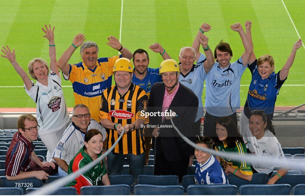 28 August 2013; The Sunday Game Presenter Michael Lyster was joined today in Croke Park by motor neurone disease (MND) sufferer Paul Lannon and friends sporting their county colours to encourage others from across Ireland to abseil 100ft off the Hogan Stand in aid of the Irish Motor Neurone Disease Association (IMNDA). At the event is Michael Lyster, Paul Lannon, from Knocktopher, Co. Kilkenny, and GAA supporters. Croke Park, Dublin. Picture credit: Brian Lawless / SPORTSFILE