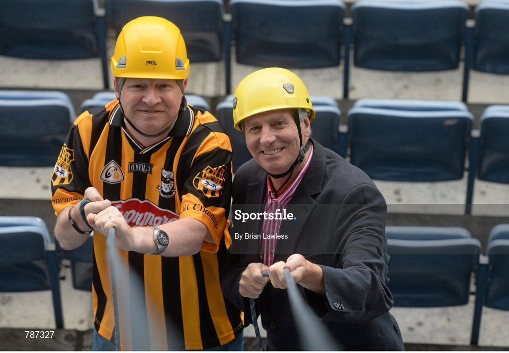 28 August 2013; The Sunday Game Presenter Michael Lyster was joined today in Croke Park by motor neurone disease (MND) sufferer Paul Lannon and friends sporting their county colours to encourage others from across Ireland to abseil 100ft off the Hogan Stand in aid of the Irish Motor Neurone Disease Association (IMNDA). At the event is Michael Lyster with Paul Lannon, from Knocktopher, Co. Kilkenny, left. Croke Park, Dublin. Picture credit: Brian Lawless / SPORTSFILE