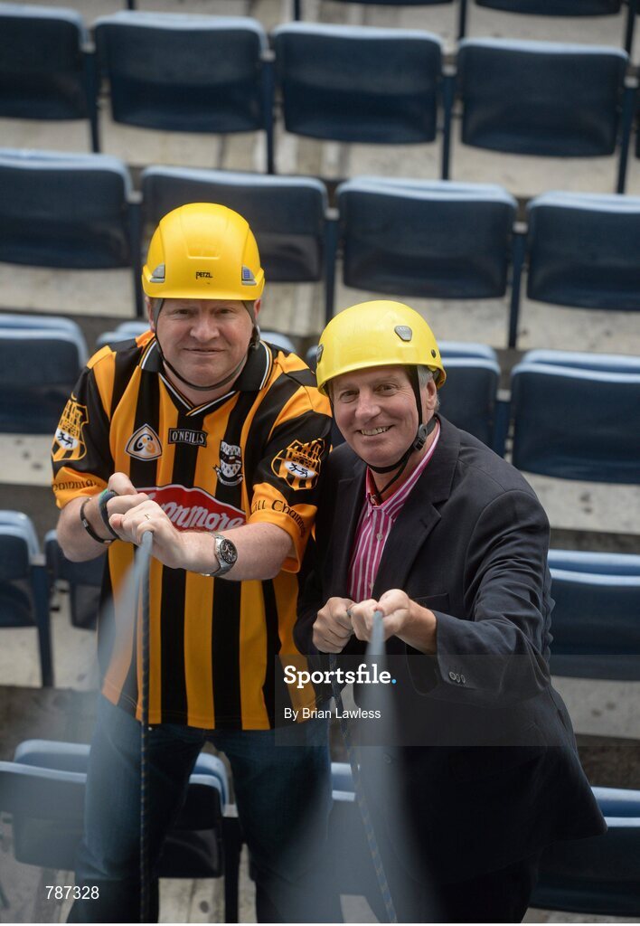 28 August 2013; The Sunday Game Presenter Michael Lyster was joined today in Croke Park by motor neurone disease (MND) sufferer Paul Lannon and friends sporting their county colours to encourage others from across Ireland to abseil 100ft off the Hogan Stand in aid of the Irish Motor Neurone Disease Association (IMNDA). At the event is Michael Lyster with Paul Lannon, from Knocktopher, Co. Kilkenny, left. Croke Park, Dublin. Picture credit: Brian Lawless / SPORTSFILE