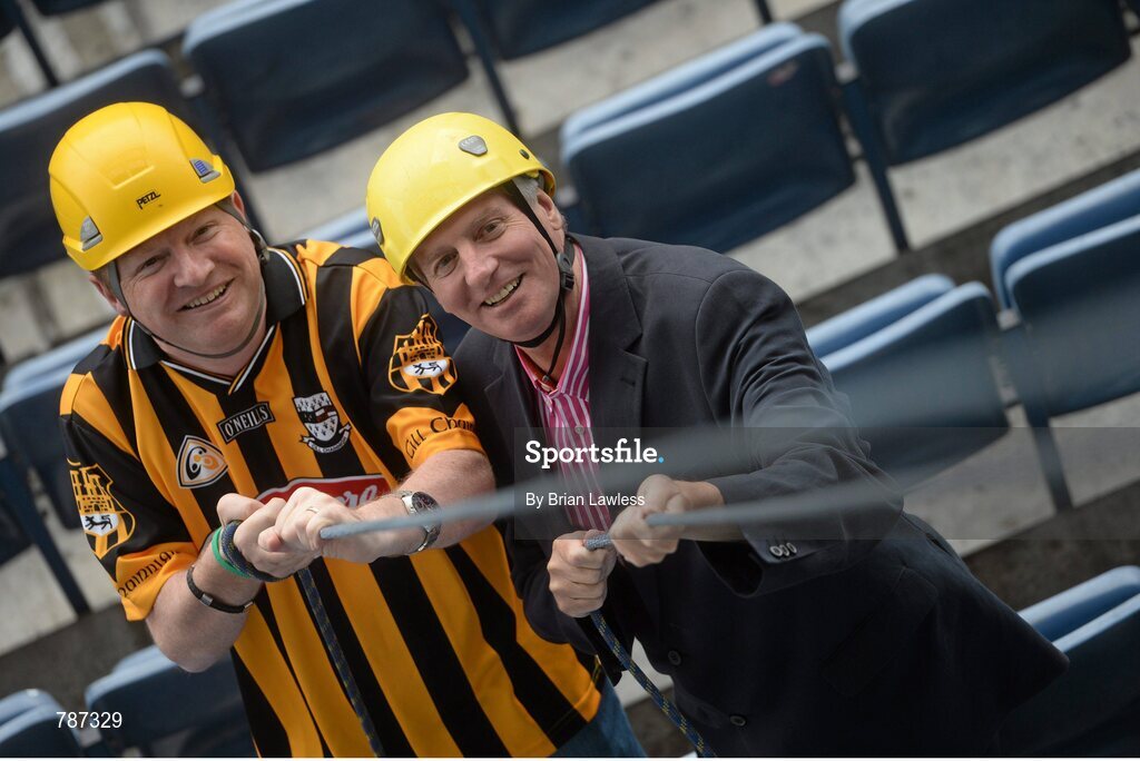 28 August 2013; The Sunday Game Presenter Michael Lyster was joined today in Croke Park by motor neurone disease (MND) sufferer Paul Lannon and friends sporting their county colours to encourage others from across Ireland to abseil 100ft off the Hogan Stand in aid of the Irish Motor Neurone Disease Association (IMNDA). At the event is Michael Lyster with Paul Lannon, from Knocktopher, Co. Kilkenny, left. Croke Park, Dublin. Picture credit: Brian Lawless / SPORTSFILE