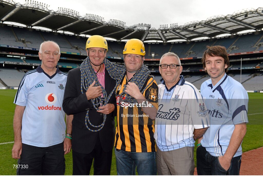 28 August 2013; The Sunday Game Presenter Michael Lyster was joined today in Croke Park by motor neurone disease (MND) sufferer Paul Lannon and friends sporting their county colours to encourage others from across Ireland to abseil 100ft off the Hogan Stand in aid of the Irish Motor Neurone Disease Association (IMNDA). At the event is Michael Lyster and Paul Lannon, from Knocktopher, Co. Kilkenny, with Dublin supporters, from left, Seamus Bonner, Owen Taaffe, and Rob Coombes. Croke Park, Dublin. Picture credit: Brian Lawless / SPORTSFILE