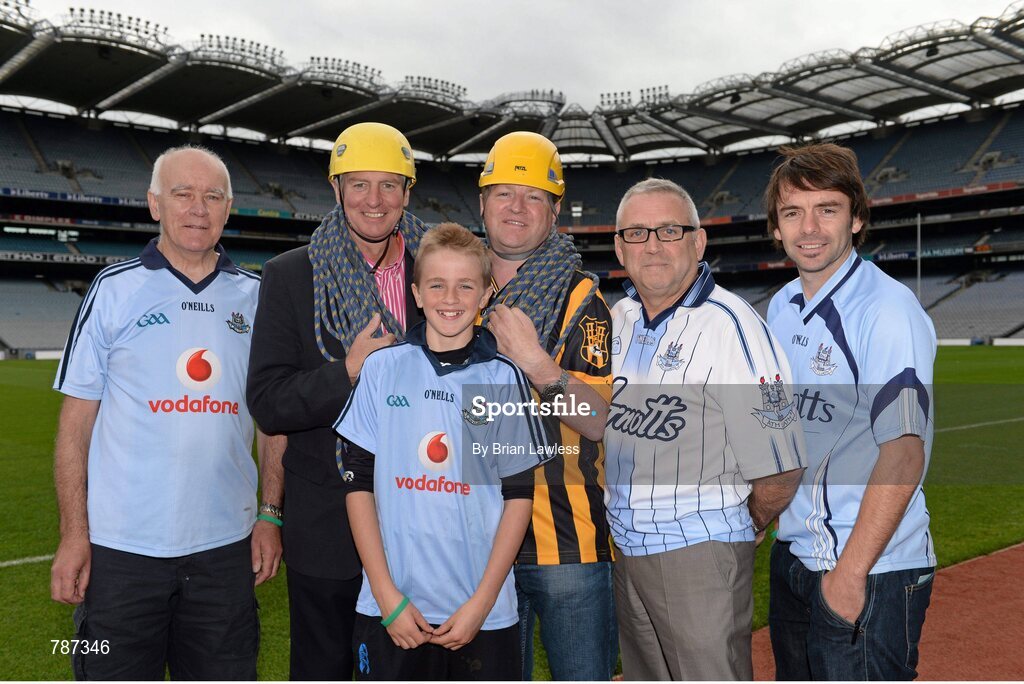 28 August 2013; The Sunday Game Presenter Michael Lyster was joined today in Croke Park by motor neurone disease (MND) sufferer Paul Lannon and friends sporting their county colours to encourage others from across Ireland to abseil 100ft off the Hogan Stand in aid of the Irish Motor Neurone Disease Association (IMNDA). At the event is Michael Lyster with Paul Lannon, from Knocktopher, Co. Kilkenny, left. Croke Park, Dublin. Picture credit: Brian Lawless / SPORTSFILE