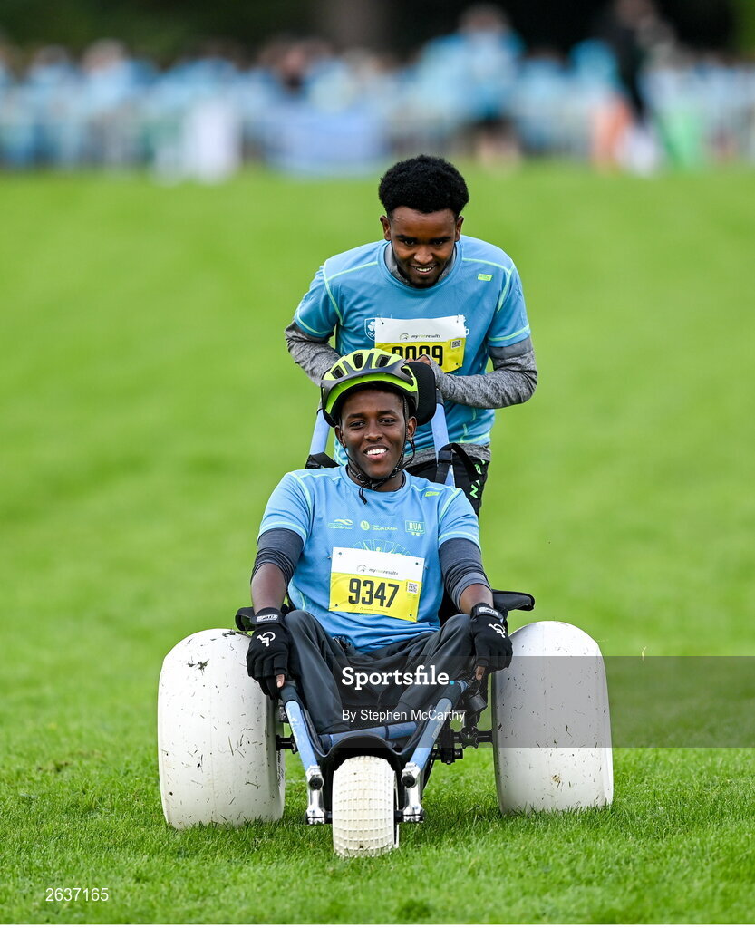 1 October 2023; Liibaan Ahmed Mohammed is pushed by Ismail Yusuf Abuukar during the Permanent TSB Sanctuary Run 2023 at the Cross Country track of the Sport Ireland Campus in Dublin. The Permanent TSB Sanctuary Run on the Sport Ireland campus attracted nearly 1,000 participants including refugees from Direct Provision centres across Ireland, Ukrainian people in Dublin, locals and Irish Olympians. The event, to celebrate diversity and interculturalism in Ireland today, was run by the Sanctuary Runners’ organisation and supported by the Olympic Federation of Ireland and Athletics Ireland. Photo by Stephen McCarthy/Sportsfile
