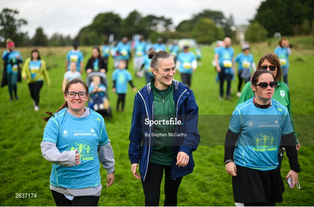 1 October 2023; Olympic gold medallist Kellie Harrington walks with twins Vicky and Katie Rooney, from Cabra, during the Permanent TSB Sanctuary Run 2023 at the Cross Country track of the Sport Ireland Campus in Dublin. The Permanent TSB Sanctuary Run on the Sport Ireland campus attracted nearly 1,000 participants including refugees from Direct Provision centres across Ireland, Ukrainian people in Dublin, locals and Irish Olympians. The event, to celebrate diversity and interculturalism in Ireland today, was run by the Sanctuary Runners’ organisation and supported by the Olympic Federation of Ireland and Athletics Ireland. Photo by Stephen McCarthy/Sportsfile