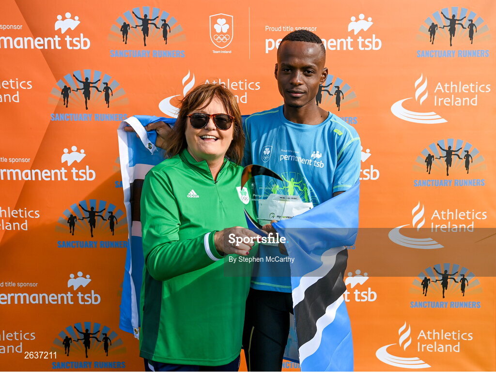 1 October 2023; Kahumburuka Ivan Tuahuku, originally from Botswana, is presented with the winners trophy by Catherine Tiernan, Olympic Federation of Ireland commercial director, after winning the Permanent TSB Sanctuary Run 2023 at the Cross Country track of the Sport Ireland Campus in Dublin. The Permanent TSB Sanctuary Run on the Sport Ireland campus attracted nearly 1,000 participants including refugees from Direct Provision centres across Ireland, Ukrainian people in Dublin, locals and Irish Olympians. The event, to celebrate diversity and interculturalism in Ireland today, was run by the Sanctuary Runners’ organisation and supported by the Olympic Federation of Ireland and Athletics Ireland. Photo by Stephen McCarthy/Sportsfile