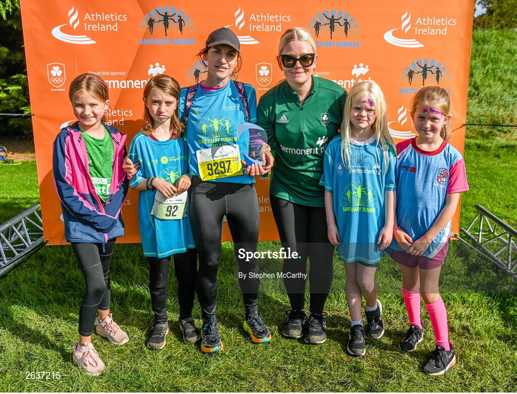 1 October 2023; Sorcha Loughnane is presented with her winners trophy by Courtnee Kyle, sustainability and sponsorships manager at Permanent TSB, during the Permanent TSB Sanctuary Run 2023 at the Cross Country track of the Sport Ireland Campus in Dublin. The Permanent TSB Sanctuary Run on the Sport Ireland campus attracted nearly 1,000 participants including refugees from Direct Provision centres across Ireland, Ukrainian people in Dublin, locals and Irish Olympians. The event, to celebrate diversity and interculturalism in Ireland today, was run by the Sanctuary Runners’ organisation and supported by the Olympic Federation of Ireland and Athletics Ireland. Photo by Stephen McCarthy/Sportsfile