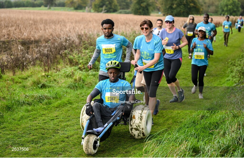 1 October 2023; Liibaan Ahmed Mohammed is pushed by Ismail Yusuf Abuukar, left, and Sandra Sithole, right, during the Permanent TSB Sanctuary Run 2023 at the Cross Country track of the Sport Ireland Campus in Dublin. The Permanent TSB Sanctuary Run on the Sport Ireland campus attracted nearly 1,000 participants including refugees from Direct Provision centres across Ireland, Ukrainian people in Dublin, locals and Irish Olympians. The event, to celebrate diversity and interculturalism in Ireland today, was run by the Sanctuary Runners’ organisation and supported by the Olympic Federation of Ireland and Athletics Ireland. Photo by Stephen McCarthy/Sportsfile