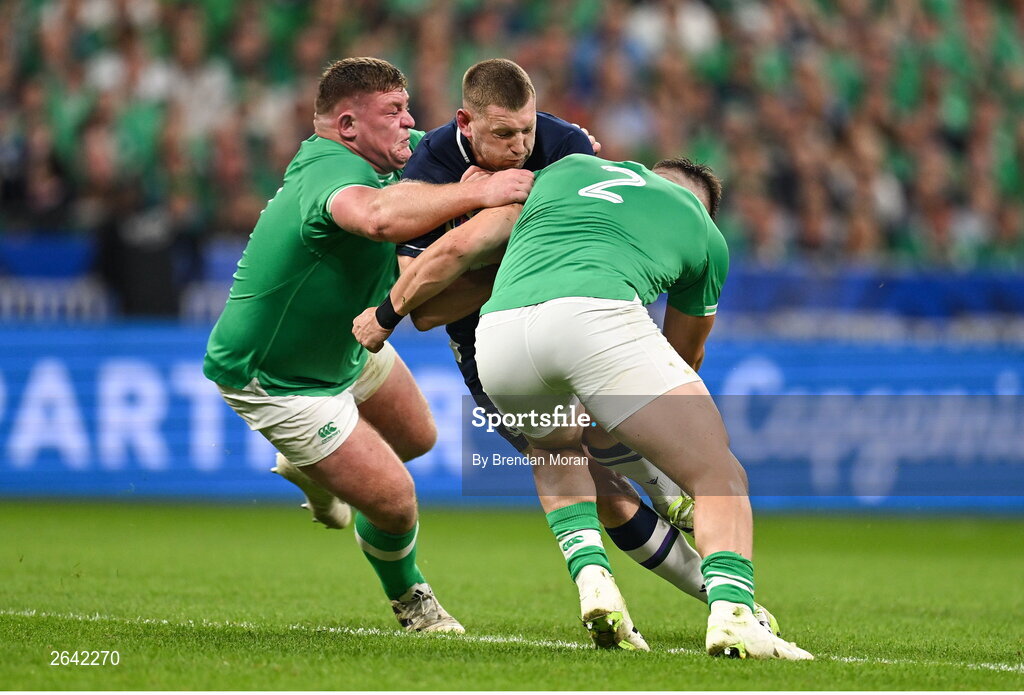 7 October 2023; Finn Russell of Scotland is tackled by Ireland players Tadhg Furlong, left, and Dan Sheehan during the 2023 Rugby World Cup Pool B match between Ireland and Scotland at the Stade de France in Paris, France. Photo by Brendan Moran/Sportsfile