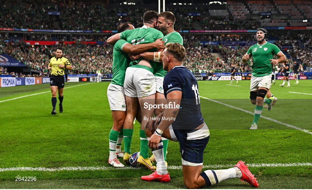 7 October 2023; Hugo Keenan of Ireland, centre, celebrates with teammates Jamison Gibson-Park, left, and Stuart McCloskey, right, after scoring their side's second try during the 2023 Rugby World Cup Pool B match between Ireland and Scotland at the Stade de France in Paris, France. Photo by Harry Murphy/Sportsfile