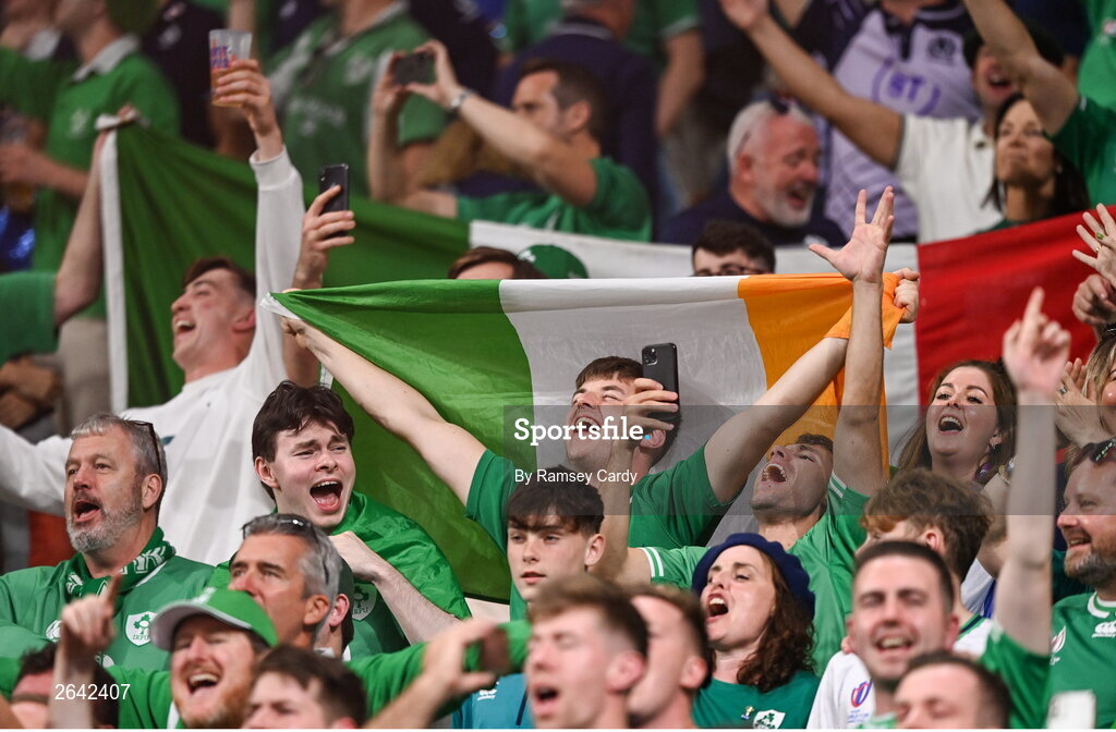 7 October 2023; Ireland supporters celebrate after their side's victory in the 2023 Rugby World Cup Pool B match between Ireland and Scotland at the Stade de France in Paris, France. Photo by Ramsey Cardy/Sportsfile