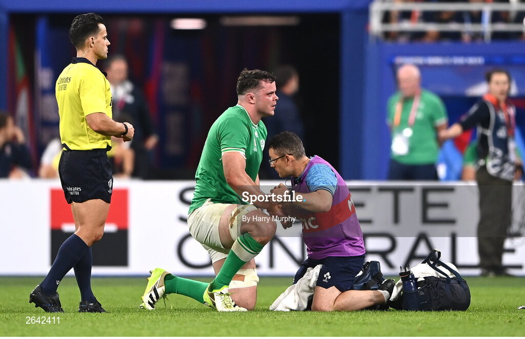 7 October 2023; James Ryan of Ireland, left, receives medical treatment from Ireland team lead physiotherapist Stephen Mutch during the 2023 Rugby World Cup Pool B match between Ireland and Scotland at the Stade de France in Paris, France. Photo by Harry Murphy/Sportsfile
