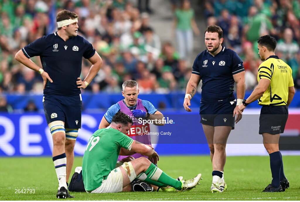 7 October 2023; James Ryan of Ireland is treated for an injury by Ireland team doctor Ciaran Cosgrave during the 2023 Rugby World Cup Pool B match between Ireland and Scotland at the Stade de France in Paris, France. Photo by Ramsey Cardy/Sportsfile
