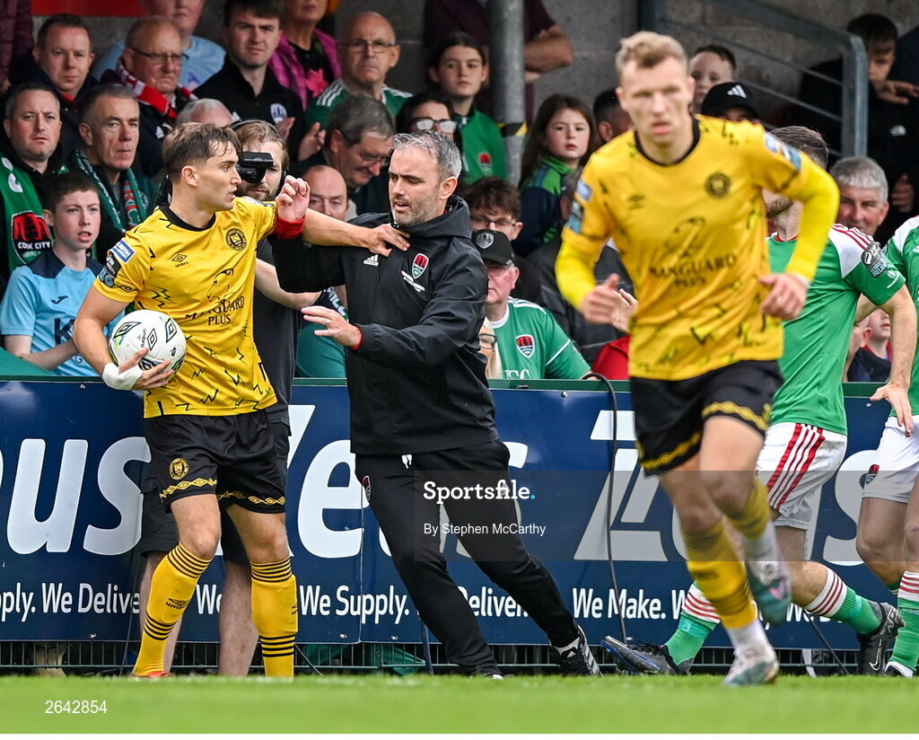 8 October 2023; Anto Breslin of St Patrick's Athletic and Cork City manager Richie Holland tussle over possession of the ball during the Sports Direct Men’s FAI Cup semi-final match between Cork City and St Patrick's Athletic at Turner’s Cross in Cork. Photo by Stephen McCarthy/Sportsfile