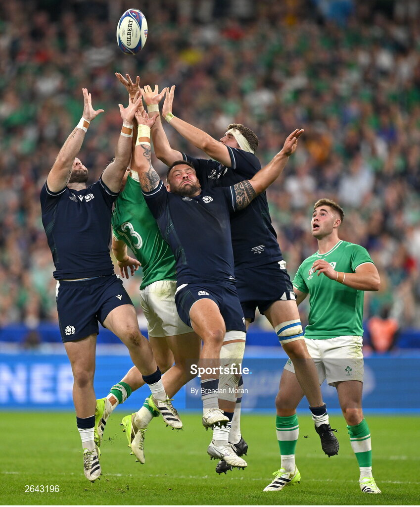 7 October 2023; Garry Ringrose of Ireland contests a high ball against Scotland players Ewan Ashman, Rory Sutherland and Scott Cummings  during the 2023 Rugby World Cup Pool B match between Ireland and Scotland at the Stade de France in Paris, France. Photo by Brendan Moran/Sportsfile