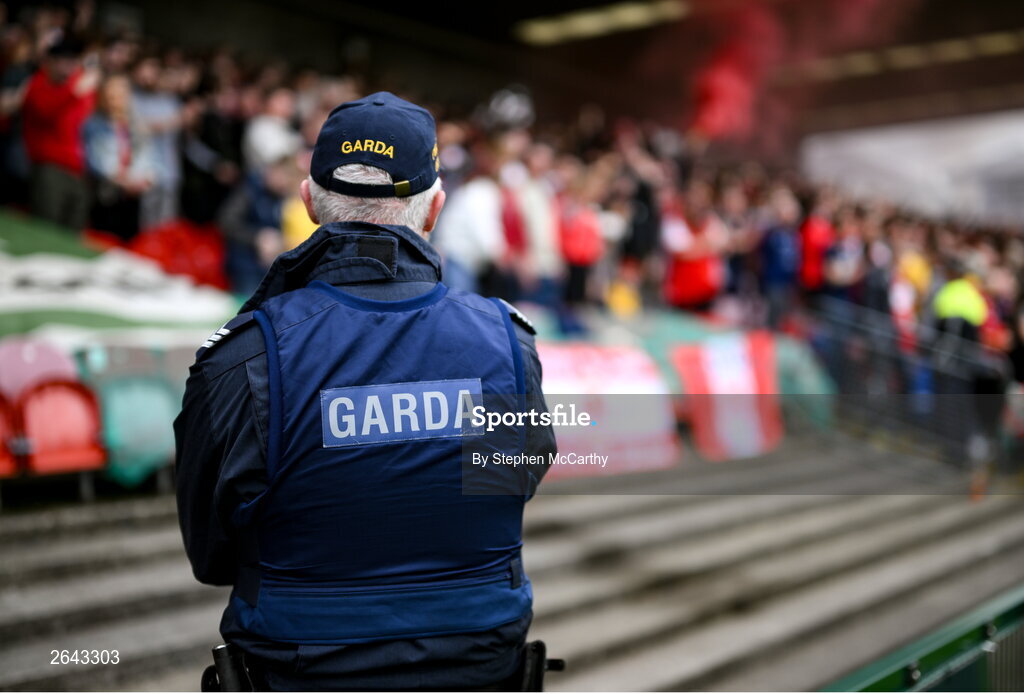 8 October 2023; A member of An Garda Síochána watches in the direction of supporters before the Sports Direct Men’s FAI Cup semi-final match between Cork City and St Patrick's Athletic at Turner’s Cross in Cork. Photo by Stephen McCarthy/Sportsfile