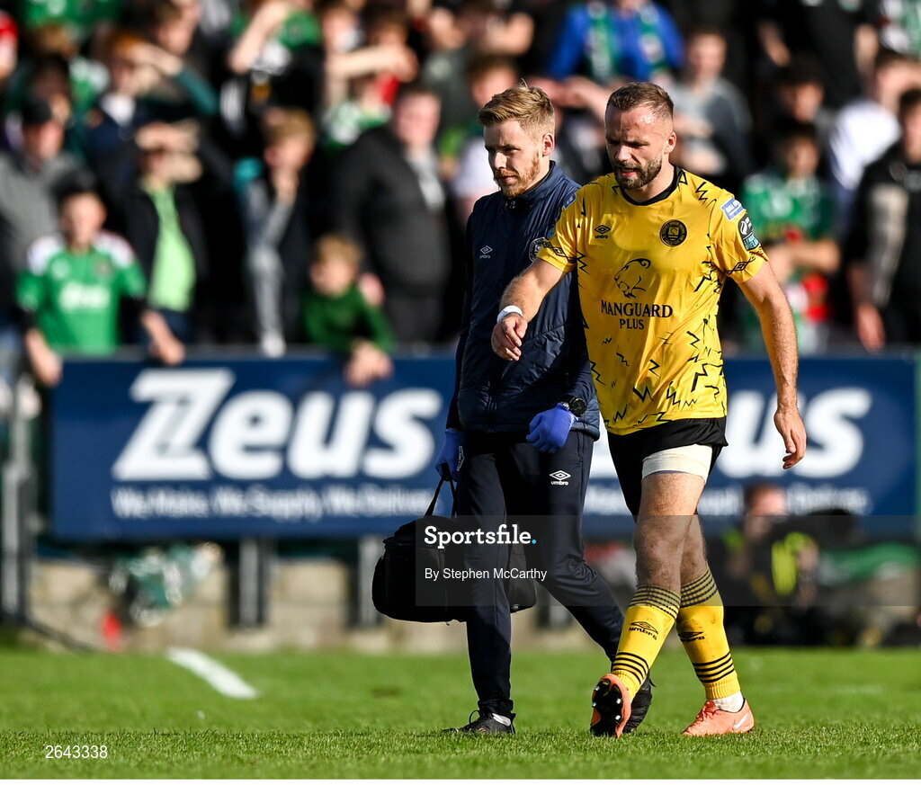 8 October 2023; Ryan McLoughlin of St Patrick's Athletic leaves the pitch to receive medical attention with St Patrick's Athletic head of medical Sam Rice during the Sports Direct Men’s FAI Cup semi-final match between Cork City and St Patrick's Athletic at Turner’s Cross in Cork. Photo by Stephen McCarthy/Sportsfile
