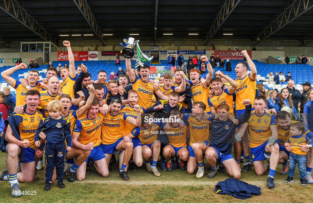 15 October 2023; St Joseph's captain Brian Daly lifts the cup as his team-mates celebrate after the Laois County Senior Club Football Championship final match between St Joseph's and Portlaoise at Laois Hire O'Moore Park in Portlaoise, Laois. Photo by Matt Browne/Sportsfile