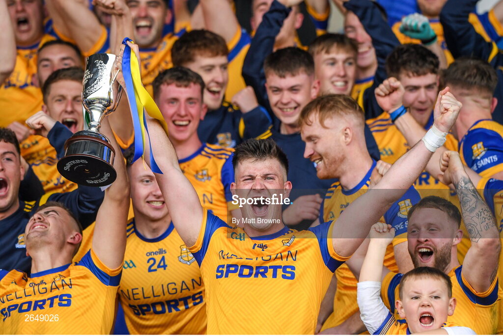 15 October 2023; St Joseph's captain Brian Daly lifts the cup as his team-mates celebrate after the Laois County Senior Club Football Championship final match between St Joseph's and Portlaoise at Laois Hire O'Moore Park in Portlaoise, Laois. Photo by Matt Browne/Sportsfile