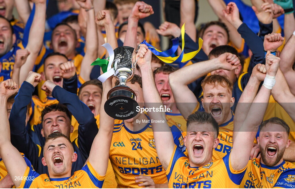 15 October 2023; St Joseph's captain Brian Daly lifts the cup as his team-mates celebrate after the Laois County Senior Club Football Championship final match between St Joseph's and Portlaoise at Laois Hire O'Moore Park in Portlaoise, Laois. Photo by Matt Browne/Sportsfile