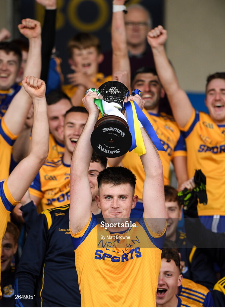 15 October 2023; St Joseph's captain Brian Daly lifts the cup as his team-mates celebrate after the Laois County Senior Club Football Championship final match between St Joseph's and Portlaoise at Laois Hire O'Moore Park in Portlaoise, Laois. Photo by Matt Browne/Sportsfile