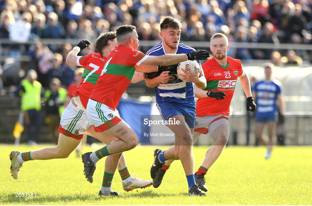 22 October 2023; Dan Cooney of Blessington in action against Gary Byrne, Sam O'Dowd and Fionn O'Sullivan of Rathnew during the Wicklow County Senior Club Football Championship final between Blessington and Rathnew at Echelon Park in Aughrim, Wicklow. Photo by Matt Browne/Sportsfile