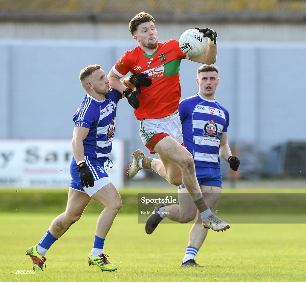 22 October 2023; Sam O'Dowd of Rathnew in action against Kevin Hanlon of Blessington during the Wicklow County Senior Club Football Championship final between Blessington and Rathnew at Echelon Park in Aughrim, Wicklow. Photo by Matt Browne/Sportsfile