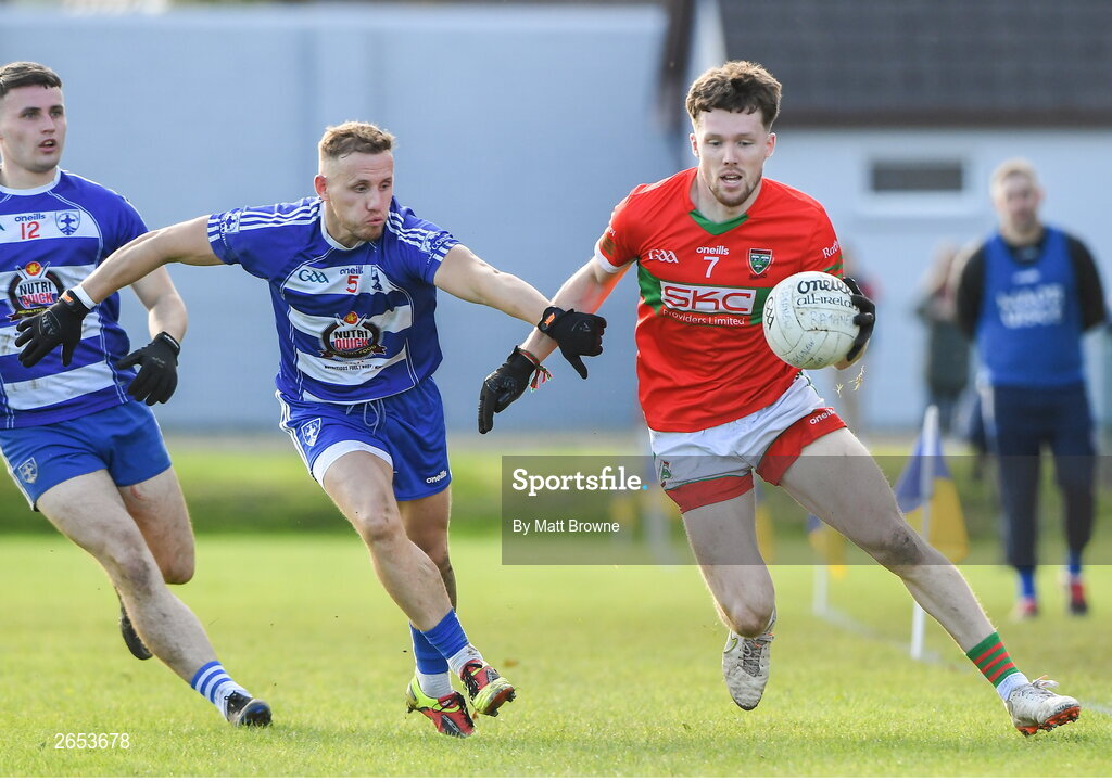 22 October 2023; Sam O'Dowd of Rathnew in action against Kevin Hanlon of Blessington during the Wicklow County Senior Club Football Championship final between Blessington and Rathnew at Echelon Park in Aughrim, Wicklow. Photo by Matt Browne/Sportsfile