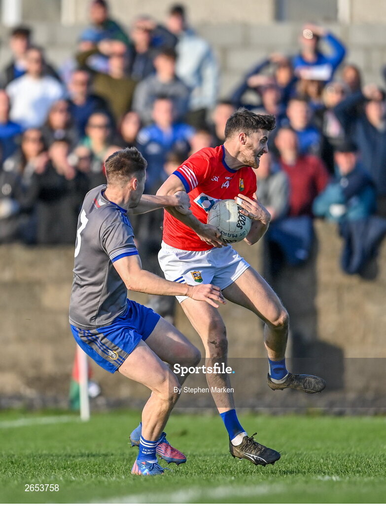 22 October 2023; Dáire McConnon of Ardee St Mary's in action against Thomas O'Sullivan of Naomh Mairtin during the Louth County Senior Club Football Championship final between Ardee St Mary's and Naomh Mairtin at Pairc Naomh Bríd in Dowdallshill, Louth. Photo by Stephen Marken/Sportsfile