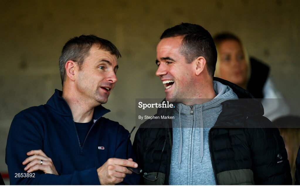 22 October 2023; Louth senior football manager Ger Brennan, right, and Louth TD Ruairí O'Murchú in attendance at the Louth County Senior Club Football Championship final between Ardee St Mary's and Naomh Mairtin at Pairc Naomh Bríd in Dowdallshill, Louth. Photo by Stephen Marken/Sportsfile