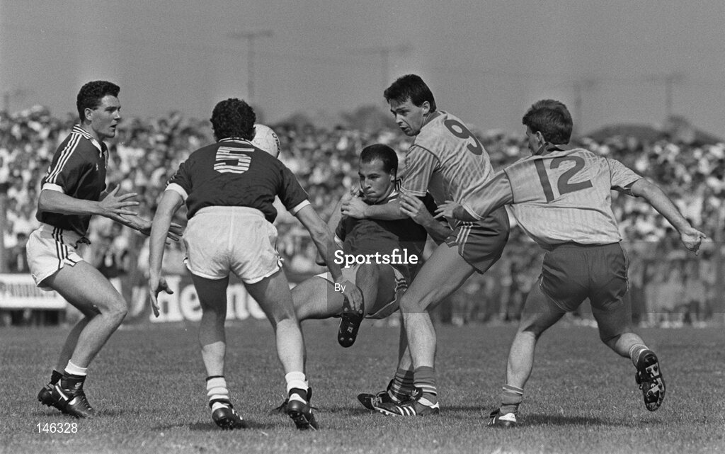 22 July 1990; Brian Moylan, Galway, supported by left, Alan Mullolhand and John Fallon, 5, is tackled by John Newton, 9, and Andy Leyland, 12, Roscommon. Galway v Roscommon, Connacht Football Championship Finals, Dr Hide Park, Co. Roscommon. Picture credit; Ray McManus / SPORTSFILE