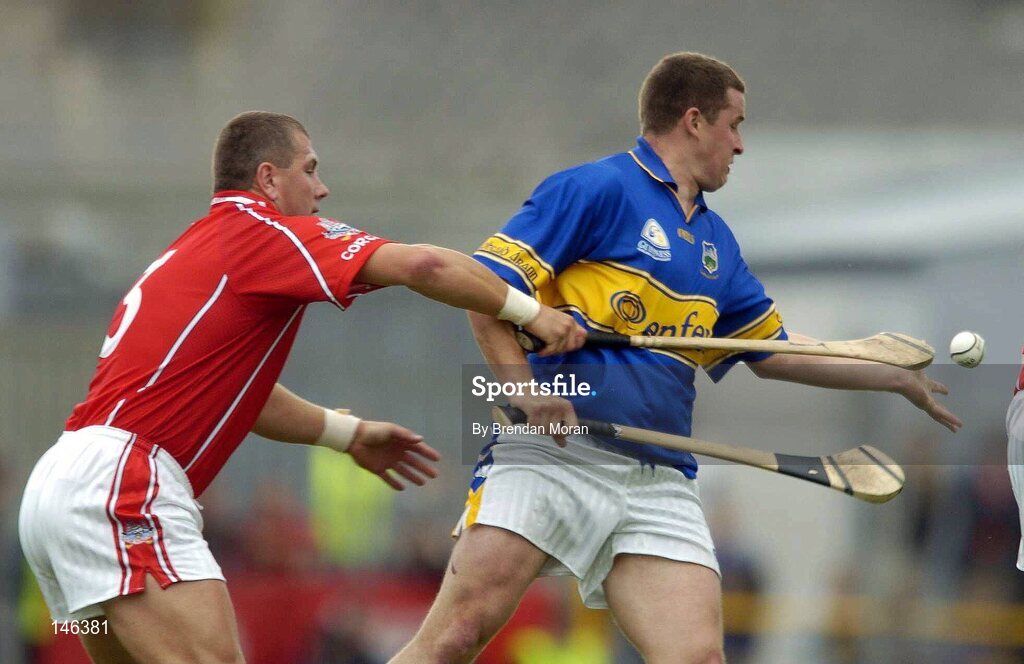 10 July 2004; John Carroll, Tipperary, in action against Diarmuid O'Sullivan, Cork. Guinness Senior Hurling Championship Qualifier, Round 3, Cork v Tipperary, Fitzgerald Stadium, Killarney, Co. Kerry. Picture credit; Brendan Moran / SPORTSFILE