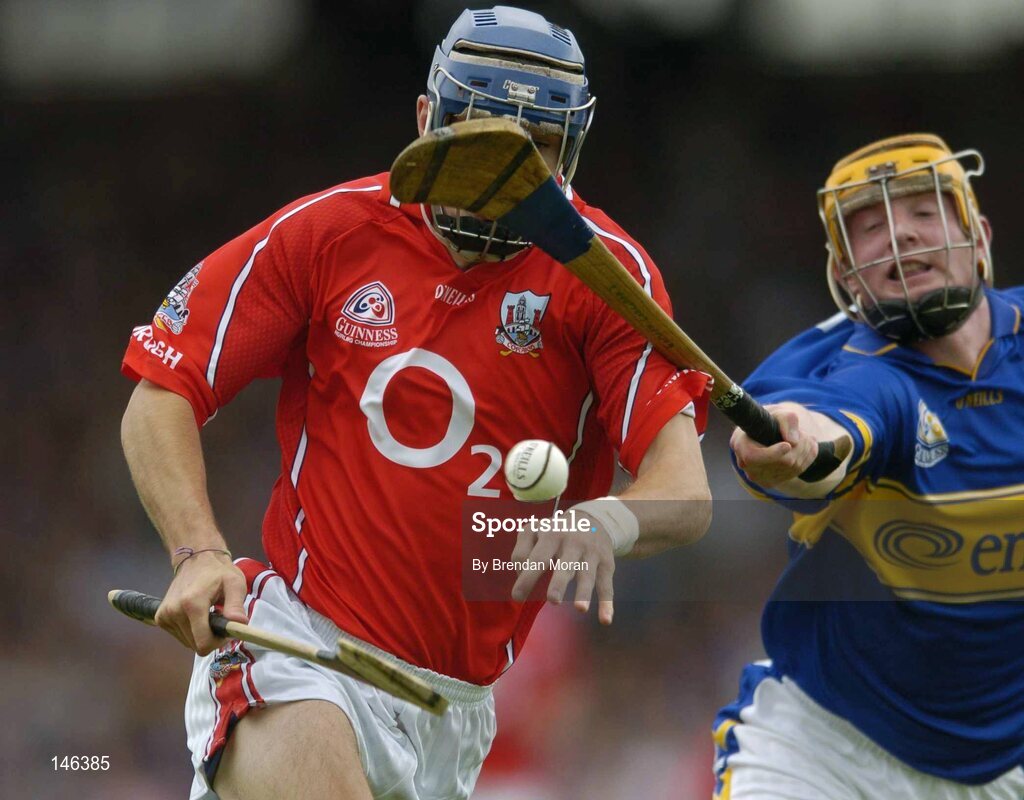 10 July 2004; Tom Kenny, Cork, in action against Eamonn Corcoran, Tipperary. Guinness Senior Hurling Championship Qualifier, Round 3, Cork v Tipperary, Fitzgerald Stadium, Killarney, Co. Kerry. Picture credit; Brendan Moran / SPORTSFILE