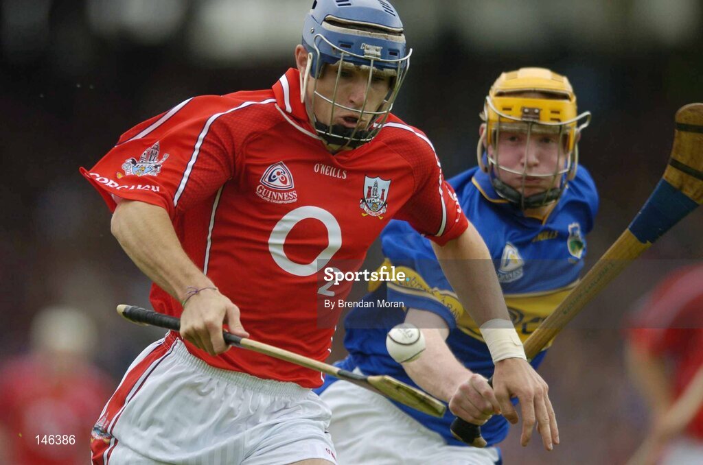10 July 2004; Tom Kenny, Cork, in action against Eamonn Corcoran, Tipperary. Guinness Senior Hurling Championship Qualifier, Round 3, Cork v Tipperary, Fitzgerald Stadium, Killarney, Co. Kerry. Picture credit; Brendan Moran / SPORTSFILE