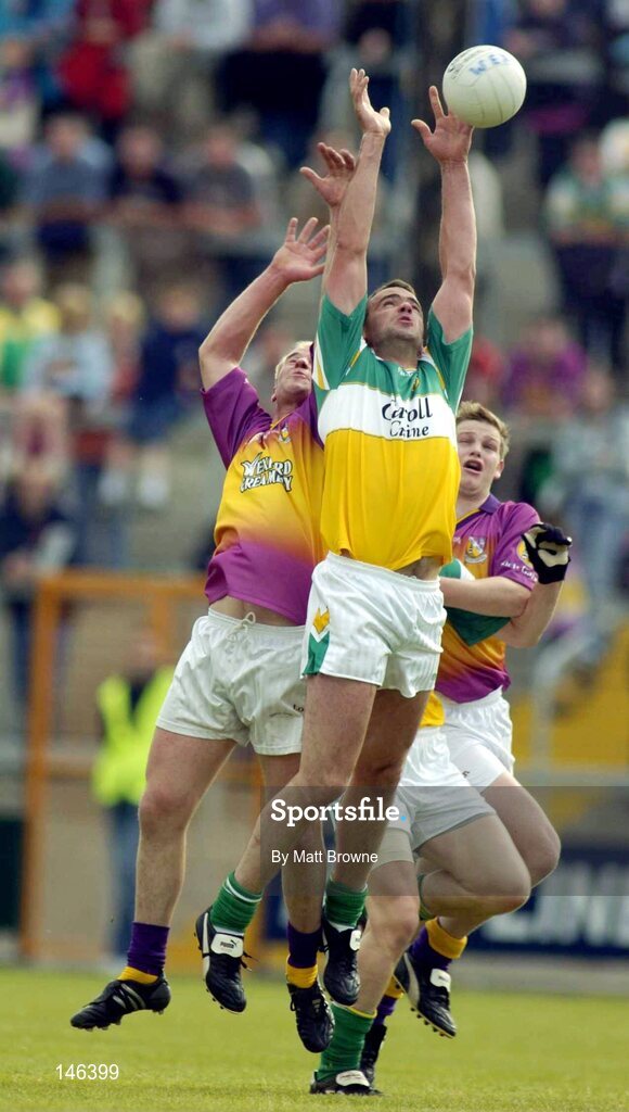 10 July 2004; James Gernnan, Offaly, in action against Willie Carley, Wexford. Bank of Ireland Senior Football Championship Qualifier, Round 2, Wexford v Offaly, Wexford Park, Wexford. Picture credit; Matt Browne / SPORTSFILE