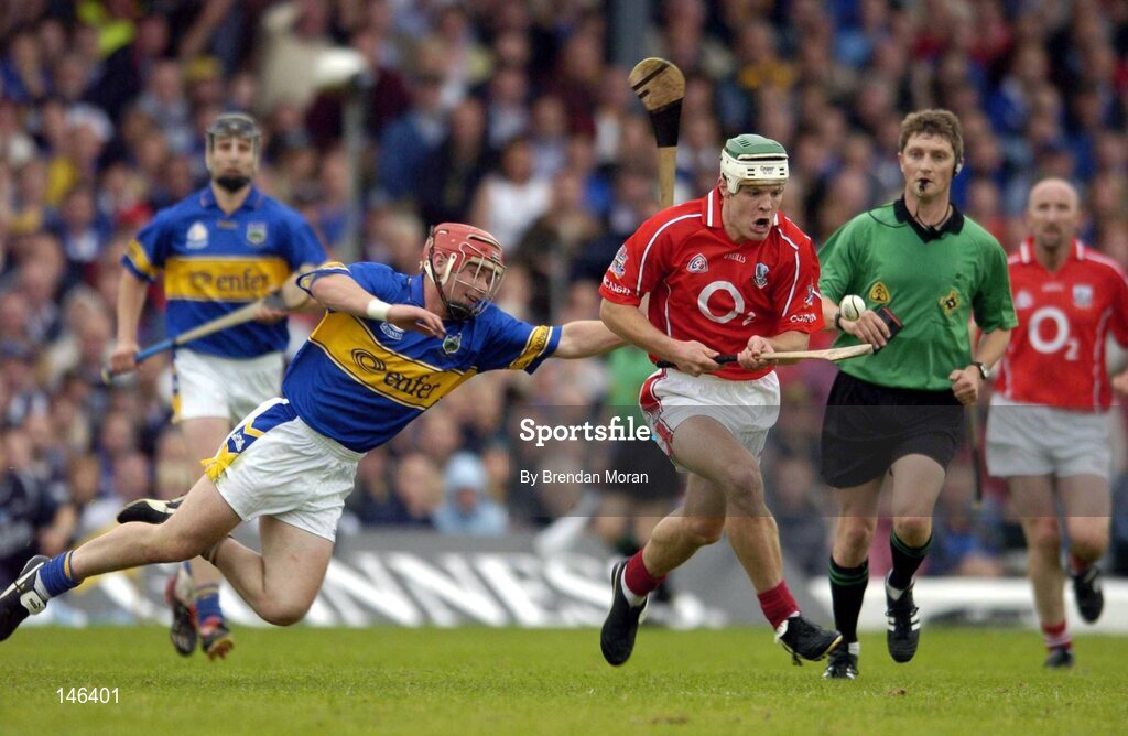 10 July 2004; Niall McCarthy, Cork, in action against Diarmaid Fitzgerald, Tipperary. Guinness Senior Hurling Championship Qualifier, Round 3, Cork v Tipperary, Fitzgerald Stadium, Killarney, Co. Kerry. Picture credit; Brendan Moran / SPORTSFILE