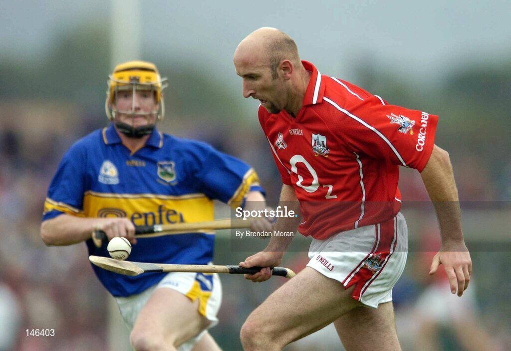 10 July 2004; Brian Corcoran, Cork, in action against Eamonn Corcoran, Tipperary. Guinness Senior Hurling Championship Qualifier, Round 3, Cork v Tipperary, Fitzgerald Stadium, Killarney, Co. Kerry. Picture credit; Brendan Moran / SPORTSFILE