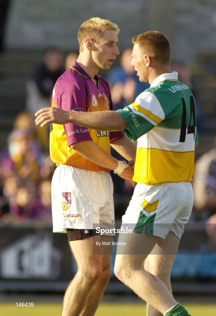 10 July 2004; Matty Forde, Wexford, is congratulated by Neville Coughlan, Offaly, after the final whistle. Bank of Ireland Senior Football Championship Qualifier, Round 2, Wexford v Offaly, Wexford Park, Wexford. Picture credit; Matt Browne / SPORTSFILE
