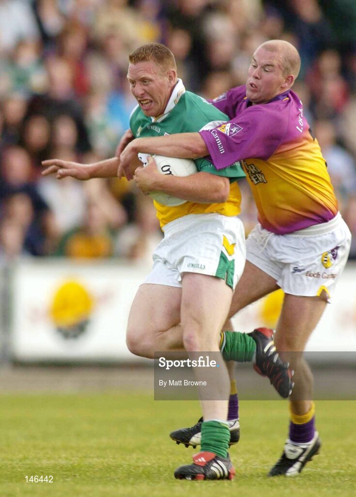 10 July 2004; Neville Coughlan, Offaly, is tackled by Leigh O'Brien, Wexford. Bank of Ireland Senior Football Championship Qualifier, Round 2, Wexford v Offaly, Wexford Park, Wexford. Picture credit; Matt Browne / SPORTSFILE