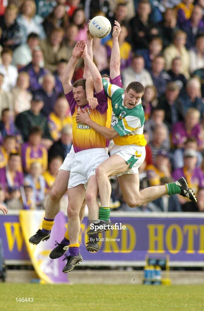 10 July 2004; Pat Forde, front, and Paddy Colfer, Wexford, in action against Ciaran McManus, Offaly. Bank of Ireland Senior Football Championship Qualifier, Round 2, Wexford v Offaly, Wexford Park, Wexford. Picture credit; Matt Browne / SPORTSFILE