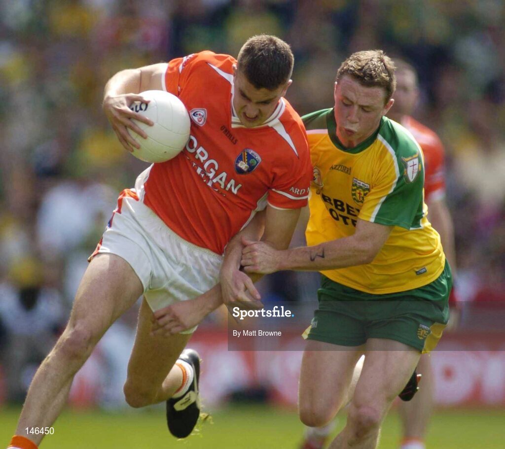 11 July 2004; Philip Loughran, Armagh, is tackled by Stephen McDermott, Donegal. Bank of Ireland Ulster Senior Football Championship Final, Armagh v Donegal, Croke Park, Dublin. Picture credit; Matt Browne / SPORTSFILE
