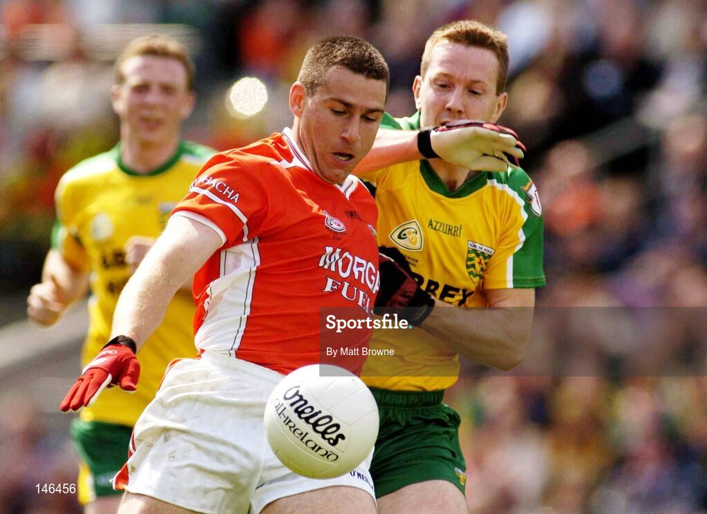 11 July 2004; Diarmuid Marsden, Armagh, is tackled by Raymond Sweeney, Donegal. Bank of Ireland Ulster Senior Football Championship Final, Armagh v Donegal, Croke Park, Dublin. Picture credit; Matt Browne / SPORTSFILE