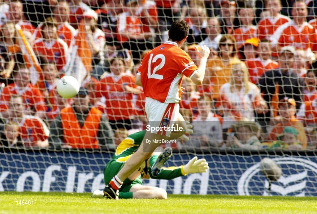 11 July 2004; Oisin McConville, Armagh, shoots the ball past Paul Durcan, Donegal keeper, to score his sides third goal. Bank of Ireland Ulster Senior Football Championship Final, Armagh v Donegal, Croke Park, Dublin. Picture credit; Matt Browne / SPORTSFILE