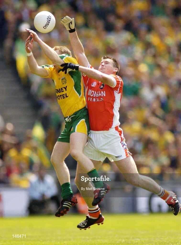 11 July 2004; Brian Roper, Donegal, is tackled by Kieran Hughes, Armagh. Bank of Ireland Ulster Senior Football Championship Final, Armagh v Donegal, Croke Park, Dublin. Picture credit; Matt Browne / SPORTSFILE