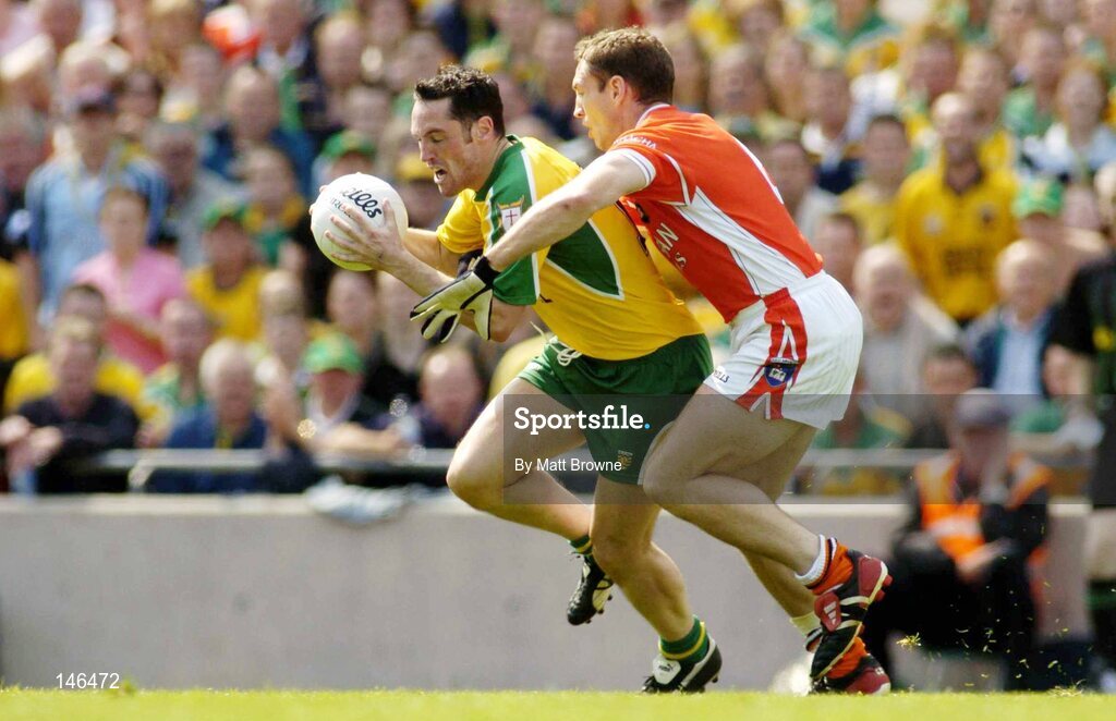 11 July 2004; Brendan Devenny, Donegal, is tackled by Kieran McGeeney, Armagh. Bank of Ireland Ulster Senior Football Championship Final, Armagh v Donegal, Croke Park, Dublin. Picture credit; Matt Browne / SPORTSFILE
