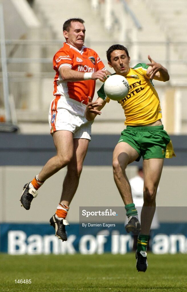 11 July 2004; Aidan O'Rourke, Armagh, contests a high ball with Michael Hegarty, Donegal. Bank of Ireland Ulster Senior Football Championship Final, Armagh v Donegal, Croke Park, Dublin. Picture credit; Damien Eagers / SPORTSFILE
