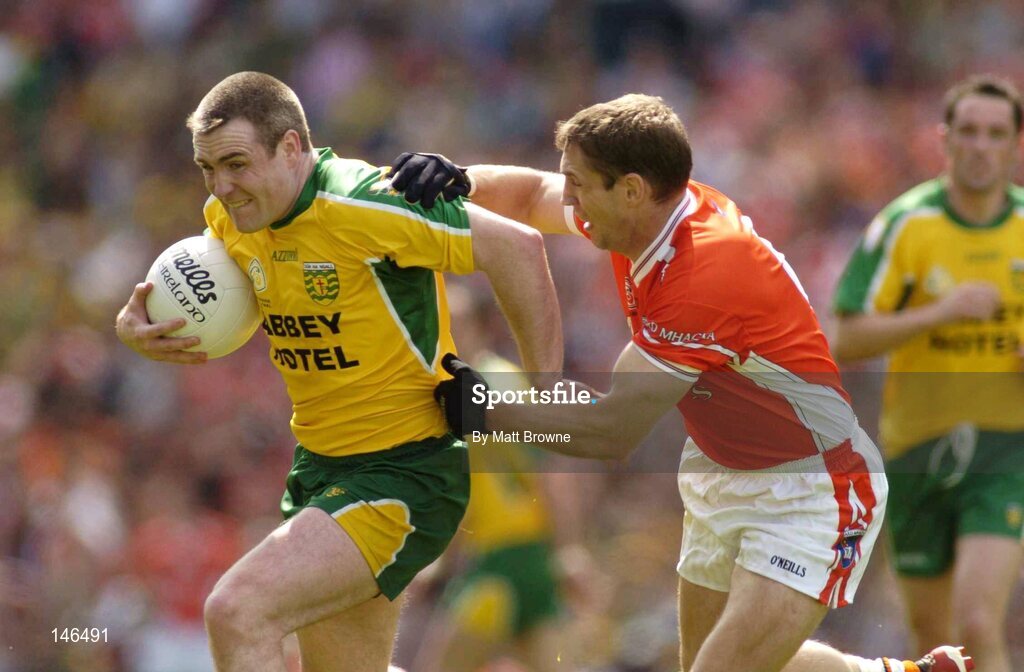 11 July 2004; John Gildea, Donegal, is tackled by Kieran McGeeney, Armagh. Bank of Ireland Ulster Senior Football Championship Final, Armagh v Donegal, Croke Park, Dublin. Picture credit; Matt Browne / SPORTSFILE